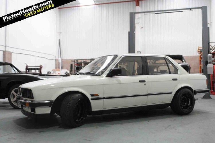 This unassuming white E30 BMW might look like a humble 3series 