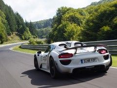 A Porsche, the 'ring and Harris in the passenger seat