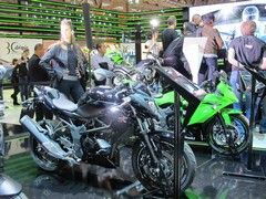 Stand girl tries to look interested by Ninja 250SL...