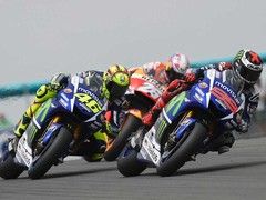 Rossi, Pedrosa and Lorenzo duking it out